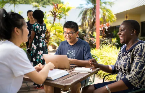 A multicultural group working to solve community problems