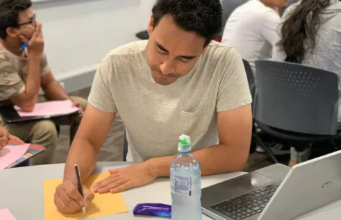 Sulav Shrestha  studying in the library 