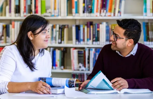 Ashweeta and friend in the library