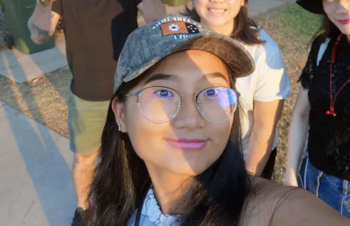 Coco outside and smiling