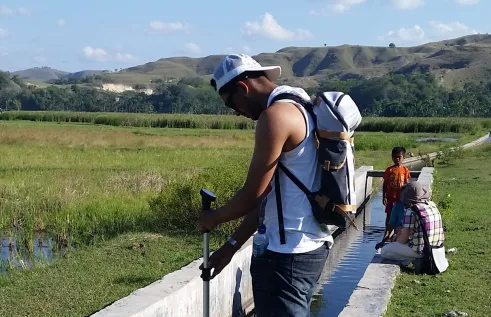 CDU student Bijay Lamsal in a green field