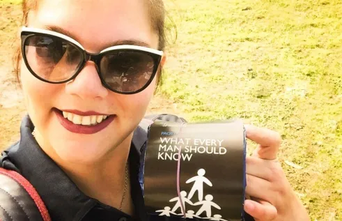 Jade Spencer holding a roll of toilet paper