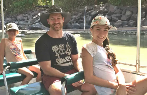 CDU Student Jason spending time on a boat with his children 
