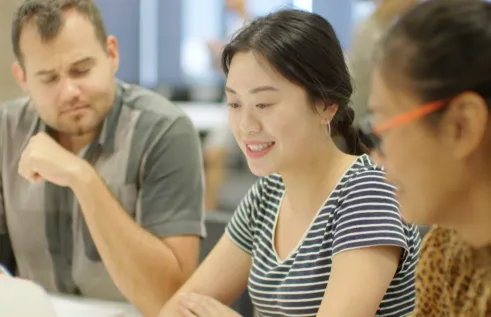 Vicky picture at university talking to uni friends