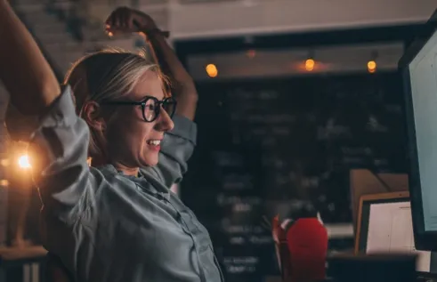 Woman stretching while studying