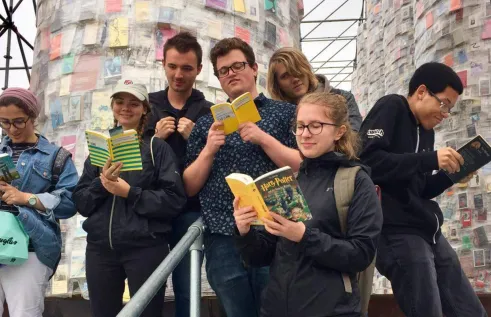 William reading books with his exchange friends
