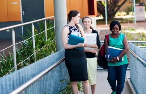Group of three students on campus