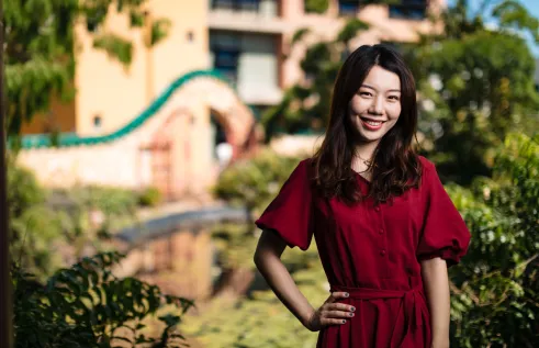 CDU student Sunny standing in a garden smiling