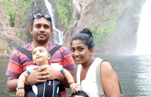 CDU student Chandu at a waterfall with her family