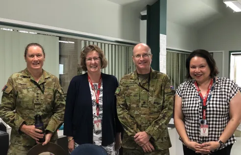 Hannah Taino smiling with colleagues