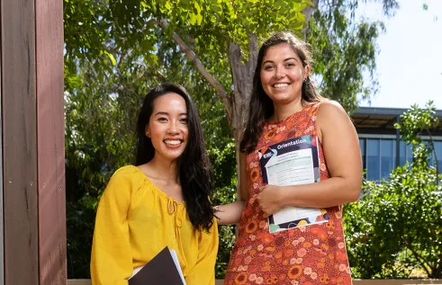 Two female international students smiling