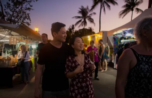 A couple exploring mindil beach market