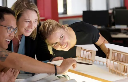 Students looking at architectural models
