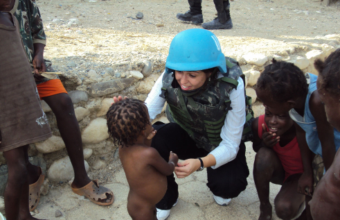 CDU Dr Izabela Pereira Watts at work with small children in a war zone
