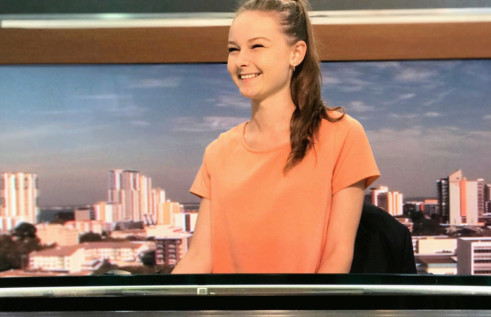 CDU student Ashleigh Abram at a news desk