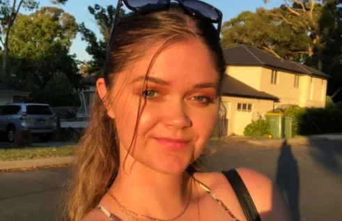 Close-up of Shailee smiling outdoors