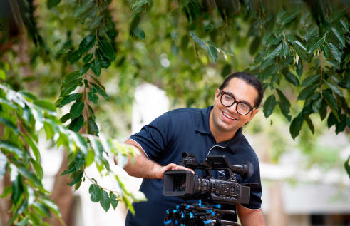 CDU photography and design student BP Bhandari behind a camera