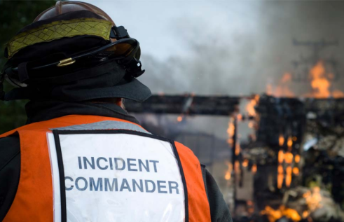 Stock image of an emergency and disaster management professional in a fire