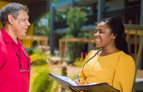 Two students on campus at CDU
