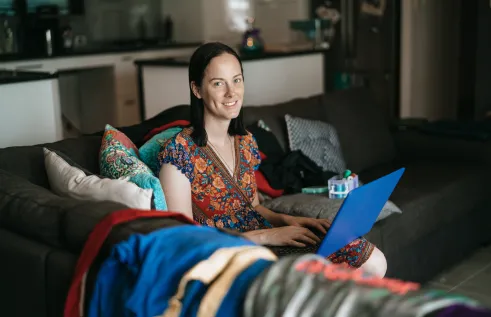 CDU student Malia studying online on her couch
