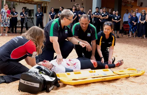 Aeromedical Retrieval demonstrators hudled around an injured person