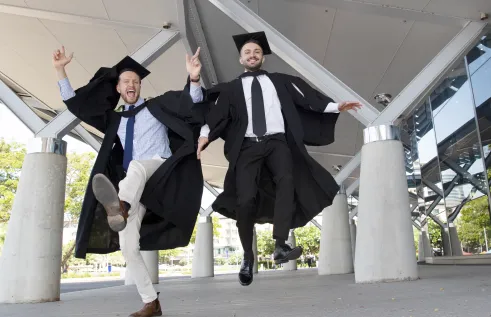 Charles Darwin University 2019 Nursing graduates James Stoddart and Samir Amiri at the last in-person graduation before the COVID-19 pandemic