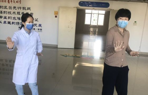 CDU researcher Li Qun Yao teaches tai chi to breast cancer survivor Qingxia Lin at the Affiliated Hospital of Putian University, Fujian, China