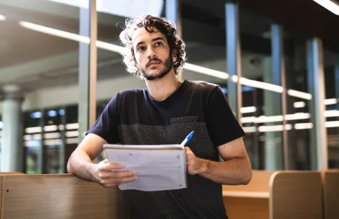 CDU student Nicholas Glinatsis in the library