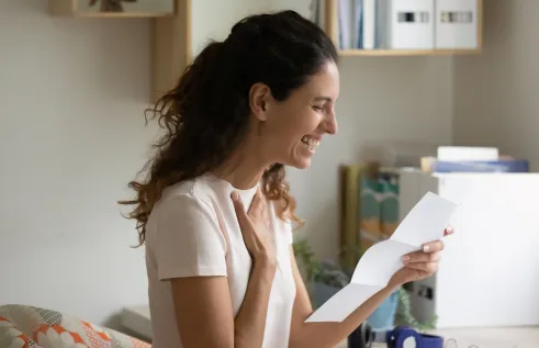 Women receiving an approved application and smiling