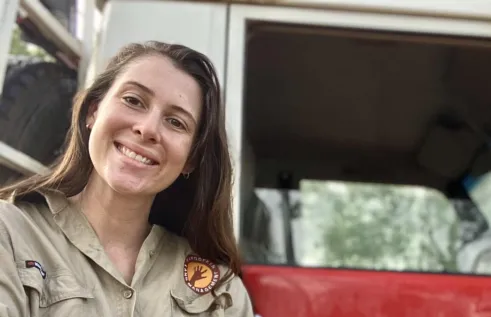 Dr Cara Penton head and shoulders with part of vehicle in background