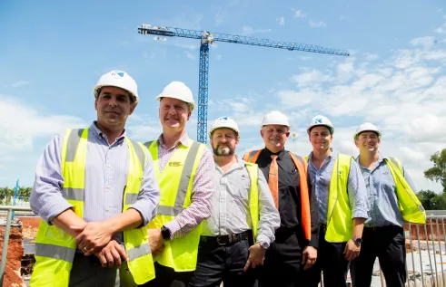 CDU Vice Chancellor Professor Scott Bowman, NT Minister for Jobs and Training Paul Kirby and Halikos construction company mark the major construction milestone for CDU's new $250m education and community precinct