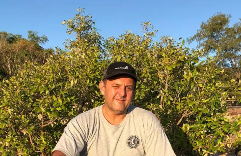 Dr Benjamin Brown head and shoulders with leaves in background