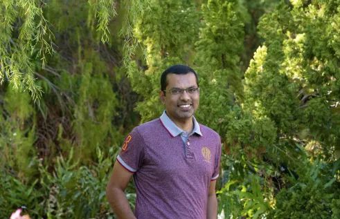 Dr Salman Quddus with green leafy background