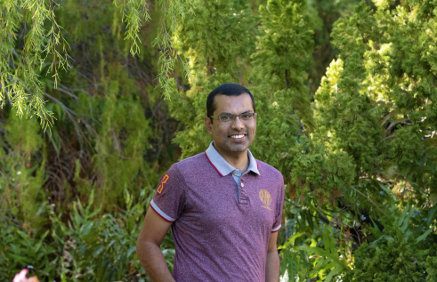 Dr Salman Quddus with green leafy background