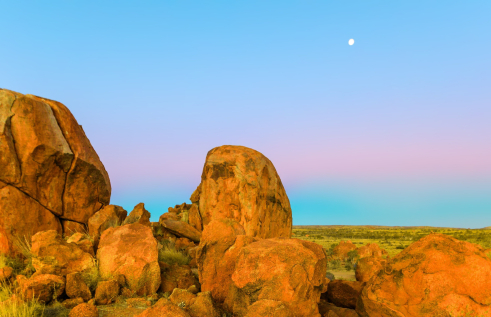 round boulders and skyline at dusk 