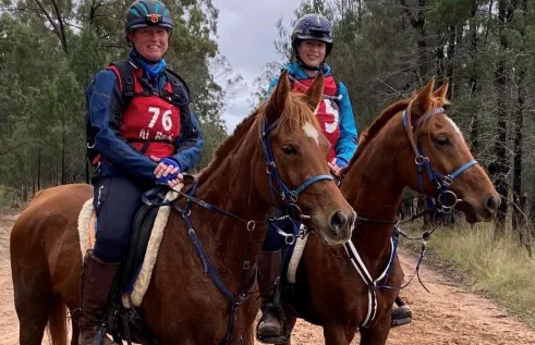 Two women on horses.