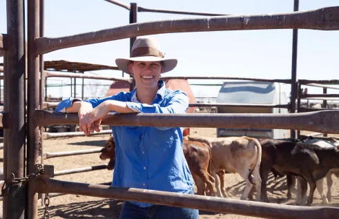 Claire Dennerley on-station with cattle.