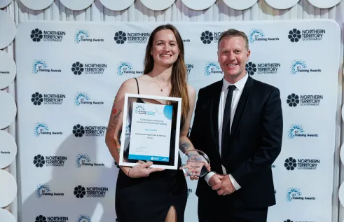 Charles Darwin University (CDU) students were among the honourees at the Northern Territory Training Awards gala held on September 3 at the Darwin Convention Centre. Pictured; Austin Asche Apprentice of the year award winner Mary Coulter and Minister for Business, Jobs and Training, Paul Kirby. 