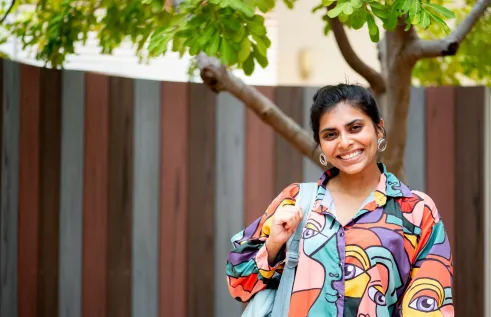 Arts student walks near library