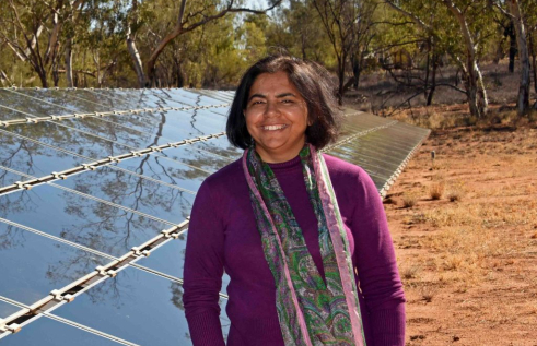 Researcher Deepika Mathur in front of Solar Panel in Alice Springs