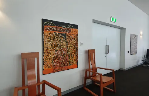Mick Ricktor’s painting “Pila nguru”, 2018 and “Morning star”, 1995 by Robyn Mununggurr are featured in the Council Room, Chancellery, Casuarina campus, CDU.