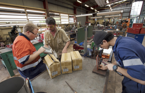 an image of students doing metal work
