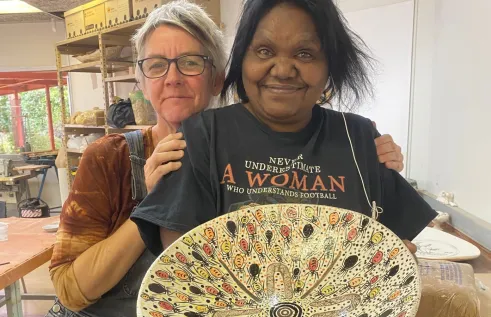 A Purple House patient creates ceramic art at CDU. 