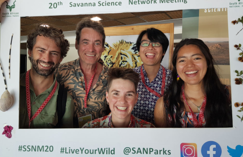 five grinning people in a frame saying 20th savanna science network meeting