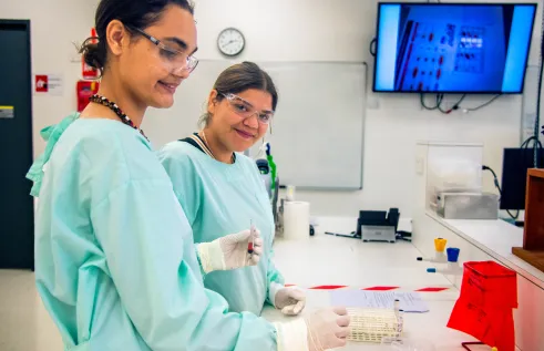 Two female First Nations Pre Health Students in a lab