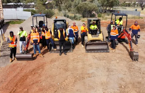 students standing with machinery