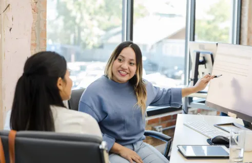 two ladies in an office setting