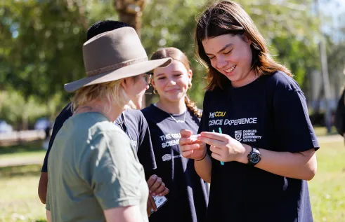 staff and students at the cdu science experience with ants