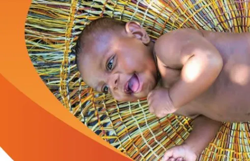 baby laying on woven mat