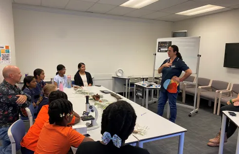 students using microscopes